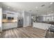Bright kitchen with stainless steel appliances, white cabinetry, and a breakfast bar at 1107 Se 49Th Ave, Ocala, FL 34471