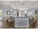 Kitchen and breakfast bar featuring pendant lights, tile backsplash, and counter seating at 1107 Se 49Th Ave, Ocala, FL 34471