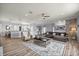 Spacious living room featuring an open layout, wood-look floors, and stylish furnishings at 1107 Se 49Th Ave, Ocala, FL 34471