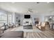 Bright living room with fireplace, light blue walls, and wood-look tile floors at 1107 Se 49Th Ave, Ocala, FL 34471