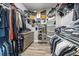 Organized walk-in closet with ample storage and shelving for clothing and accessories at 1107 Se 49Th Ave, Ocala, FL 34471