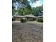 Backyard featuring enclosed pool area and spacious lawn at 1325 Nw 73Rd Ter, Ocala, FL 34482