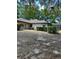 Backyard featuring well maintained bushes, trees, and a fenced in area at 1325 Nw 73Rd Ter, Ocala, FL 34482