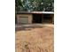 Barn-like building featuring metal siding, a garage door and attached overhang at 1325 Nw 73Rd Ter, Ocala, FL 34482