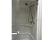 Enclosed shower and bathtub featuring a handheld shower head at 1325 Nw 73Rd Ter, Ocala, FL 34482