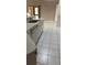 Bright kitchen boasting tile floors, white cabinetry, and natural light at 1325 Nw 73Rd Ter, Ocala, FL 34482