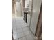Traditional kitchen featuring white cabinets, matching appliances, and tile flooring at 1325 Nw 73Rd Ter, Ocala, FL 34482