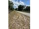 View of the home's street featuring a wooden fence on either side at 1325 Nw 73Rd Ter, Ocala, FL 34482