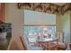 Cozy breakfast nook with a glass table and comfortable chairs, perfect for enjoying your morning coffee at 14004 Se 94Th Ave, Summerfield, FL 34491