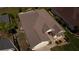 Aerial view of a charming home with a well-maintained roof, and landscaped front yard at 14004 Se 94Th Ave, Summerfield, FL 34491