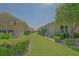 Well-maintained exterior featuring lush landscaping and manicured lawn between the homes at 14004 Se 94Th Ave, Summerfield, FL 34491
