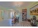 Charming home foyer featuring stylish desk and adjacent bookshelf at 14004 Se 94Th Ave, Summerfield, FL 34491