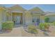 Welcoming front entrance with a decorative glass door and beautiful potted plants at 14004 Se 94Th Ave, Summerfield, FL 34491