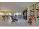 Spacious living room with leather furniture, TV, and bar seating area at 14004 Se 94Th Ave, Summerfield, FL 34491