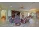Expansive living room with recliners, entertainment center, and light-green painted walls at 14004 Se 94Th Ave, Summerfield, FL 34491
