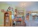 Charming office area with wooden desk, bookshelf and chandelier at 14004 Se 94Th Ave, Summerfield, FL 34491