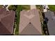 Aerial view of a home's roof showing modern architectural style and well maintained shingles in a neutral brown tone at 14004 Se 94Th Ave, Summerfield, FL 34491
