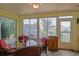 Screened patio with a table for four, perfect for outdoor dining and relaxation at 14004 Se 94Th Ave, Summerfield, FL 34491