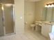 Bathroom featuring a glass shower, vanity and toilet with tile flooring at 14561 Sw 112Th Cir, Dunnellon, FL 34432