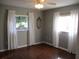 Bedroom featuring hardwood flooring and white window drapes at 14561 Sw 112Th Cir, Dunnellon, FL 34432
