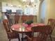 Dining area featuring a wooden table and chairs with view of kitchen at 14561 Sw 112Th Cir, Dunnellon, FL 34432
