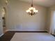 Spacious dining room shows chandelier, neutral paint, and easy access to adjacent kitchen and living spaces at 14561 Sw 112Th Cir, Dunnellon, FL 34432