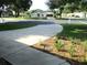 Long concrete driveway leads to a well-maintained home in a quiet, tree-lined community at 14561 Sw 112Th Cir, Dunnellon, FL 34432