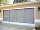 View of garage with screen door allowing light and ventilation at 14561 Sw 112Th Cir, Dunnellon, FL 34432