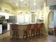 Kitchen with stainless steel appliances, breakfast bar, and pendant lighting at 14561 Sw 112Th Cir, Dunnellon, FL 34432