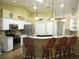 Bright kitchen featuring granite counters, stainless appliances, and bar seating at 14561 Sw 112Th Cir, Dunnellon, FL 34432