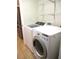 Well-equipped laundry room with modern appliances, shelving, and storage options at 14561 Sw 112Th Cir, Dunnellon, FL 34432