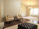 Bright living room with hardwood floors, accent chairs, and a neutral color palette at 14561 Sw 112Th Cir, Dunnellon, FL 34432