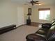 Comfortable living room with carpet, hardwood floor and a ceiling fan at 14561 Sw 112Th Cir, Dunnellon, FL 34432
