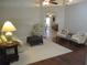 Inviting living room features a ceiling fan, stylish seating, and seamless access to adjacent living spaces at 14561 Sw 112Th Cir, Dunnellon, FL 34432