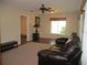 Inviting living room featuring a ceiling fan and ample natural light at 14561 Sw 112Th Cir, Dunnellon, FL 34432