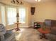 Comfortable living room with a large window and cozy seating at 14561 Sw 112Th Cir, Dunnellon, FL 34432