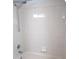 Shower area featuring wall tiles, shower head, and controls at 14561 Sw 112Th Cir, Dunnellon, FL 34432