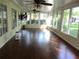 Sun room features hardwood flooring and lots of windows at 14561 Sw 112Th Cir, Dunnellon, FL 34432