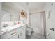 Bright bathroom with white cabinets, a granite countertop, and a shower-tub combination offers a clean and modern look at 160 Hickory Course Loop, Ocala, FL 34472
