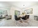 A bright dining room featuring a modern chandelier, large mirror, and stylish decor at 160 Hickory Course Loop, Ocala, FL 34472