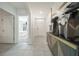 A bright entryway with decorative furnishings and tile flooring welcomes you into this beautiful home at 160 Hickory Course Loop, Ocala, FL 34472