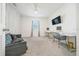 A spacious living room featuring a grey couch, decorative wall, and tv, perfect for relaxation at 160 Hickory Course Loop, Ocala, FL 34472