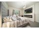 An elegant main bedroom featuring a fireplace and television, creating a cozy retreat at 160 Hickory Course Loop, Ocala, FL 34472