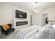 A stunning main bedroom featuring a fireplace, television, and stylish decor for relaxation at 160 Hickory Course Loop, Ocala, FL 34472