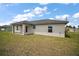 A well-maintained backyard with a covered patio, perfect for outdoor entertaining and relaxation at 20 Emerald Trl, Ocala, FL 34472