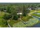 Stunning aerial view of a lakefront community, showcasing private docks, and lush greenery, offering a serene lifestyle at 23797 Ne 189Th St, Fort Mc Coy, FL 32134