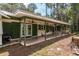 Rear covered patio is perfect for entertaining and overlooks the lake and lush landscaping at 23797 Ne 189Th St, Fort Mc Coy, FL 32134
