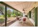 Relax on this spacious, covered patio, perfect for outdoor dining and entertaining, with views of the lake at 23797 Ne 189Th St, Fort Mc Coy, FL 32134
