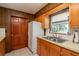 Functional kitchen featuring linoleum countertops, stainless steel sink, and natural light at 23797 Ne 189Th St, Fort Mc Coy, FL 32134