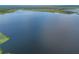 Scenic view of the expansive lake, highlighting its natural beauty and tranquility at 23797 Ne 189Th St, Fort Mc Coy, FL 32134